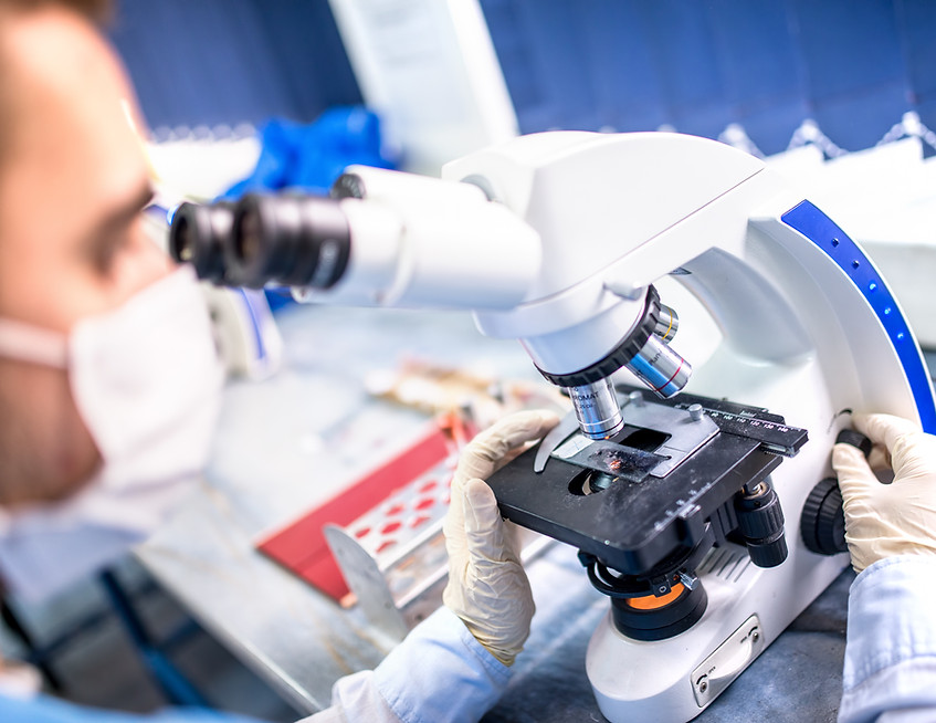 quality control technician at microscope